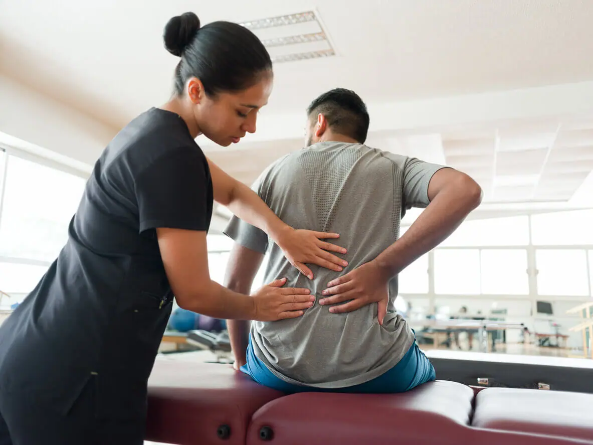 Physiotherapist treating a patient